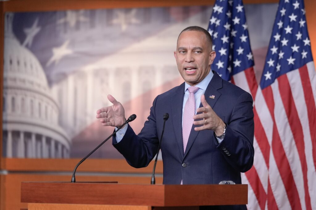 Congress Democrats Hakeem Jeffries is speaking at a podium during a press conference on Capitol Hill