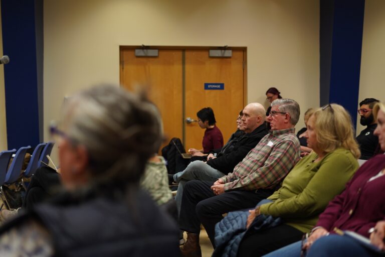 Audience members listen as Democratic hopefuls Tracy Hunt, Lucia Simonelli and Rob Strickler hold a town hall in Horsham