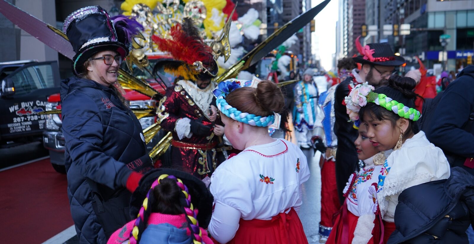 Jesa Stiglich, Golden Sunrise’s president (left) speaks with dancers from Danza Tonantzin.