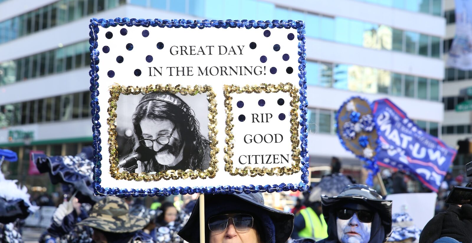 A sign at the 2026 Mummers Parade in Philadelphia honors the late WMMR host Pierre Robert