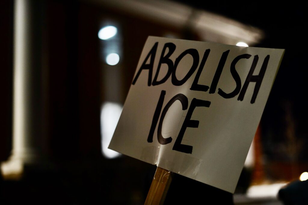 A sign reads, ''ABOLISH ICE''