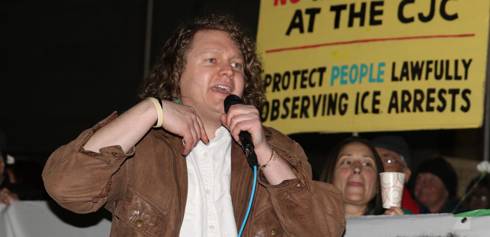 Pastor Jay Bergen of the Germantown Mennonite Church protested the shooting death of Renee Nicole Good outside of City Hall in Philadelphia on Thursday, Jan. 8, 2026. They said they're 'tired of watching armed state actors murder people.' (Cory Sharber/WHYY)