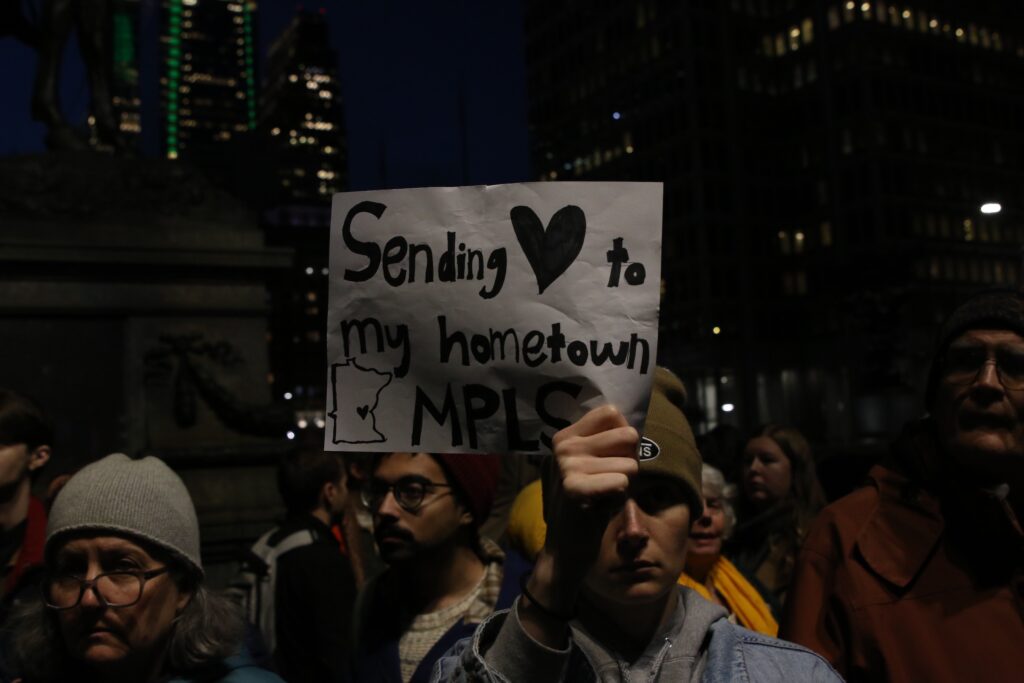 People protest the shooting of a woman by an ICE officer in Minneapolis during a gathering in Philadelphia