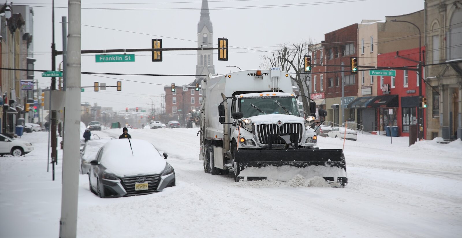 A snow plow is seen operating on Girard Avenue in Philadelphia during a snowstorm on Jan. 25, 2026