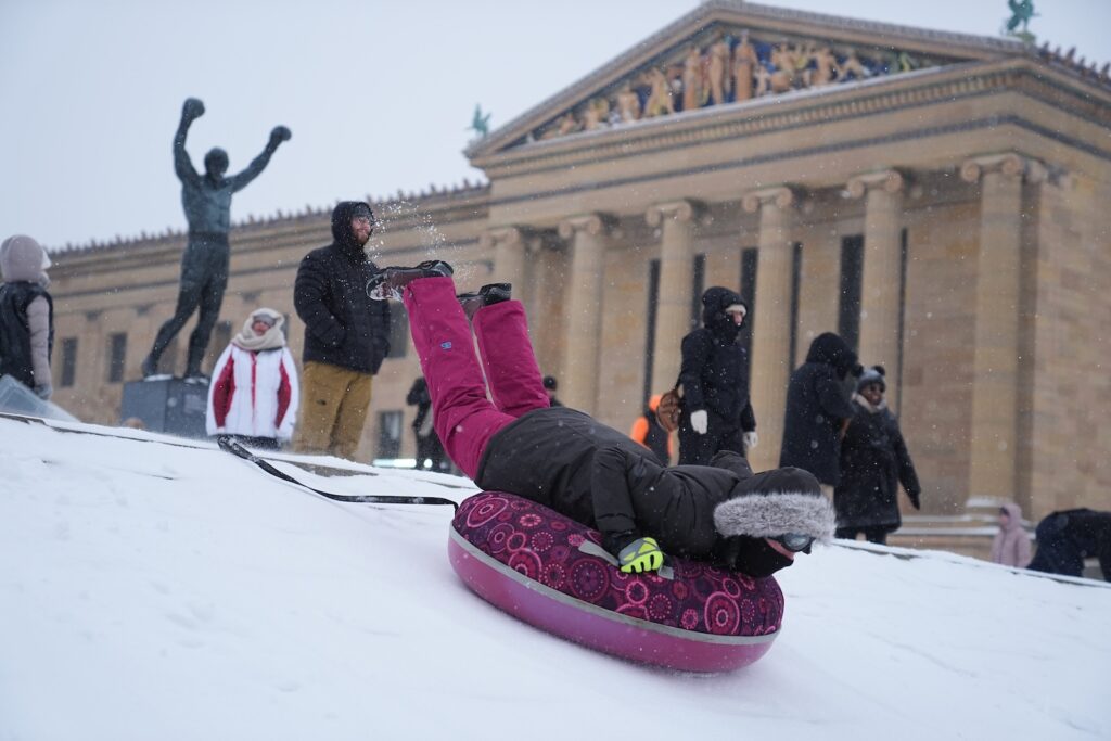 Winter Weather Philadelphia People sled on Philadelphia Art Museum steps by the Rocky statue during a winter storm in Philadelphia, Sunday, Jan. 25, 2026.