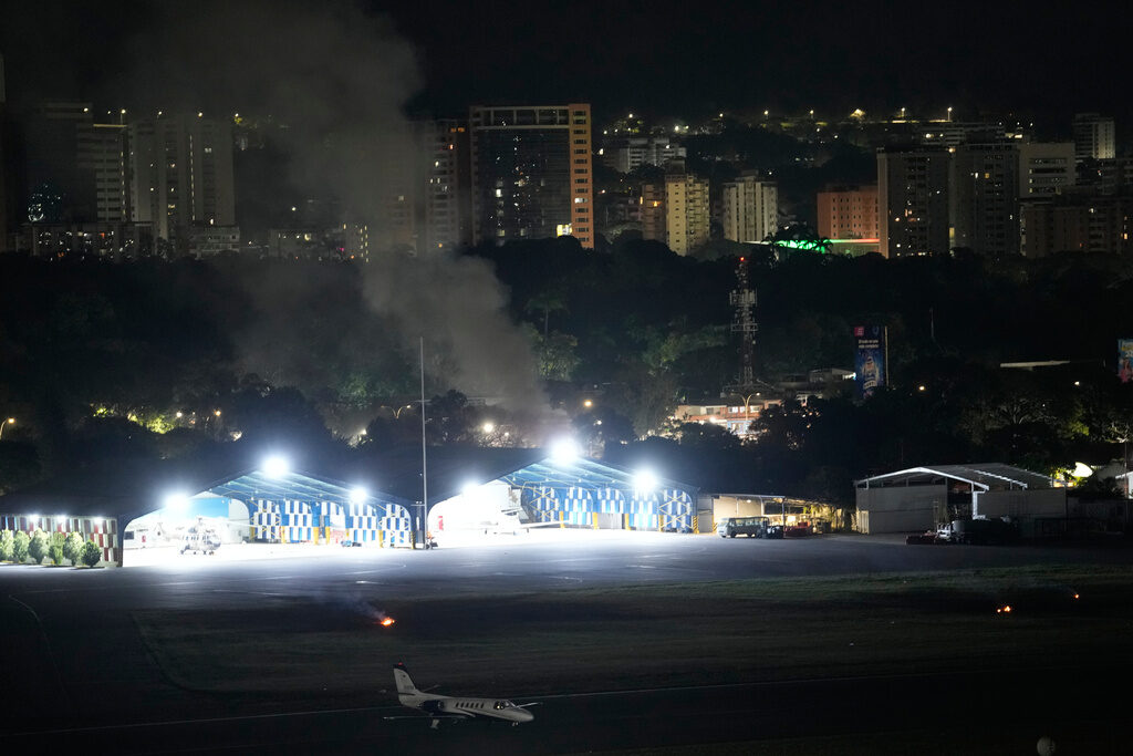 APTOPIX Venezuela US Smoke raises at La Carlota airport after explosions and low-flying aircraft were heard in Caracas, Venezuela