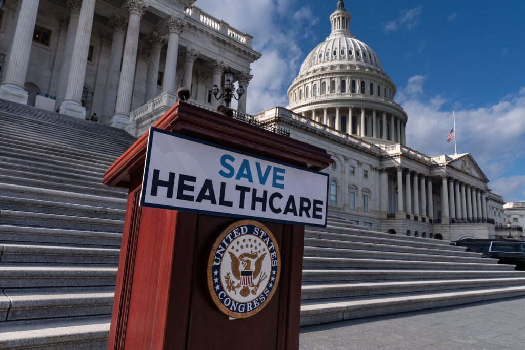 AP Poll American Priorities A lectern awaits the arrival of House Democrats to speak on the health care funding fight on the steps of the House at the Capitol in Washington, Nov. 12, 2025.