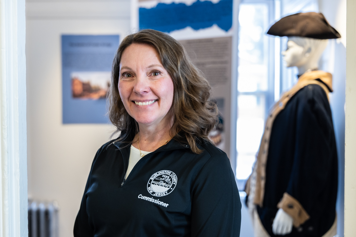 Allison Eckel, deputy director of the Burlington County Board of Commissioners, inside the Burlington County Joins the Revolution exhibit in the Warden’s House Gallery in Mt. Holly, N.J.