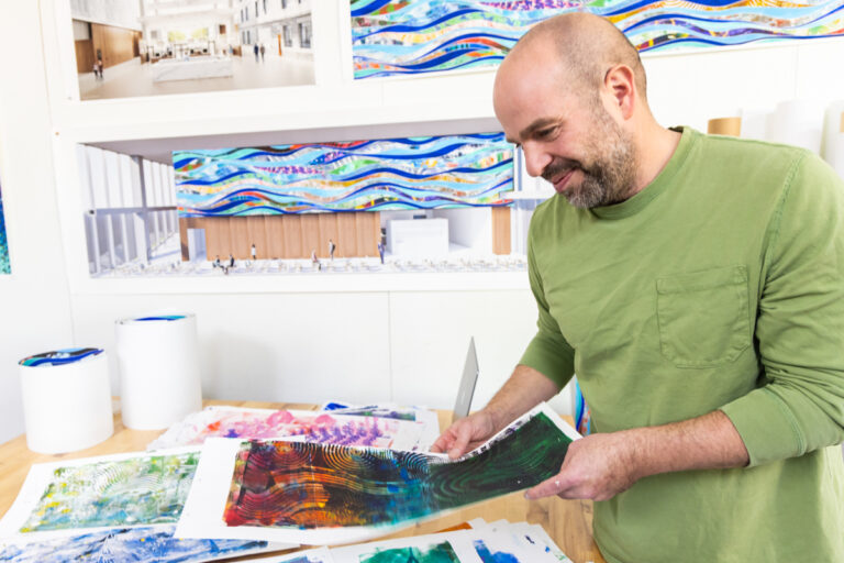 Ben Volta looking at art