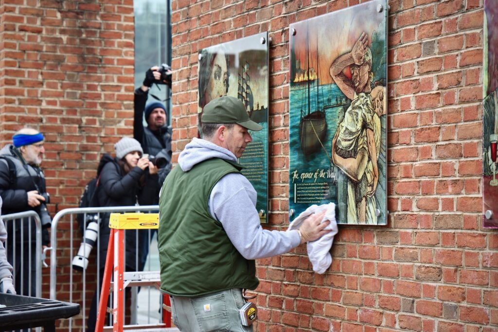 2025 02 19-e lee-philadelphia independence mall presidents house-slavery exhibit restored clean A National Park Service employee restores a panel to the slavery exhibit at the President's House site on Independence Mall.