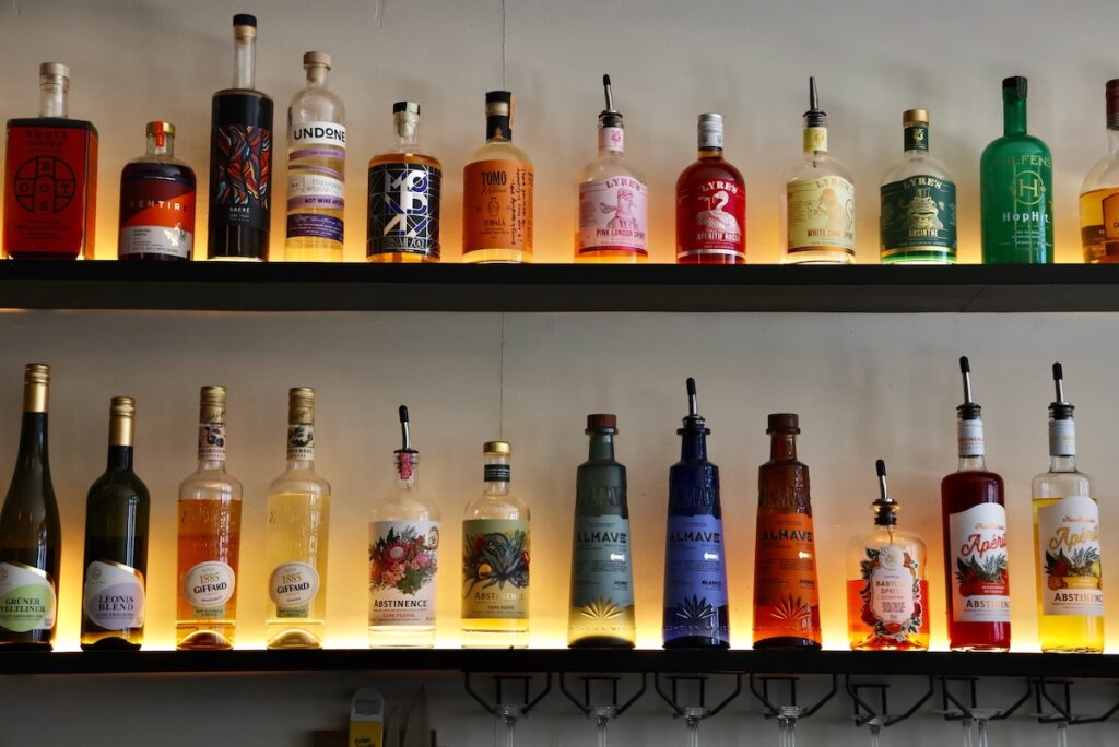 A wide array of nonalcoholic liquors are lined up behind the bar at Bar Palmina in Fishtown. (Emma Lee/WHYY)