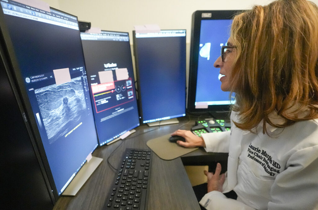 A doctor uses breast imaging AI to get a second opinion on mammography ultrasounds. (AP Photo/Mary Altaffer)