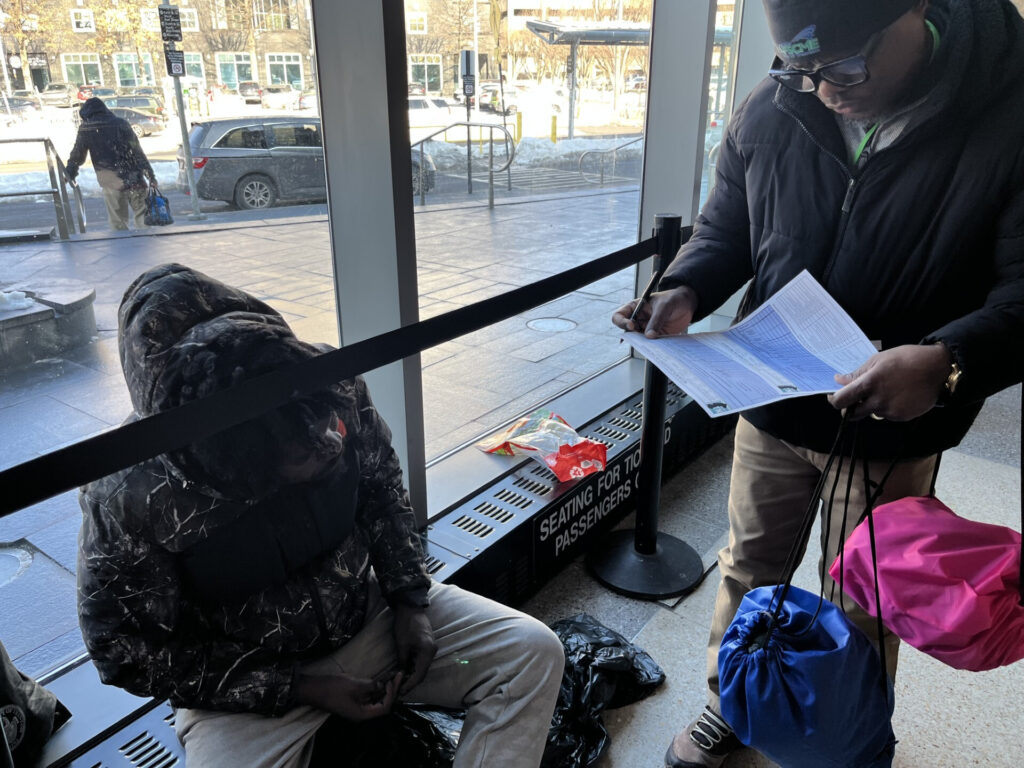 Trenton-Train-Station An unhoused man keeping warm in the Trenton Train Station answering questions
