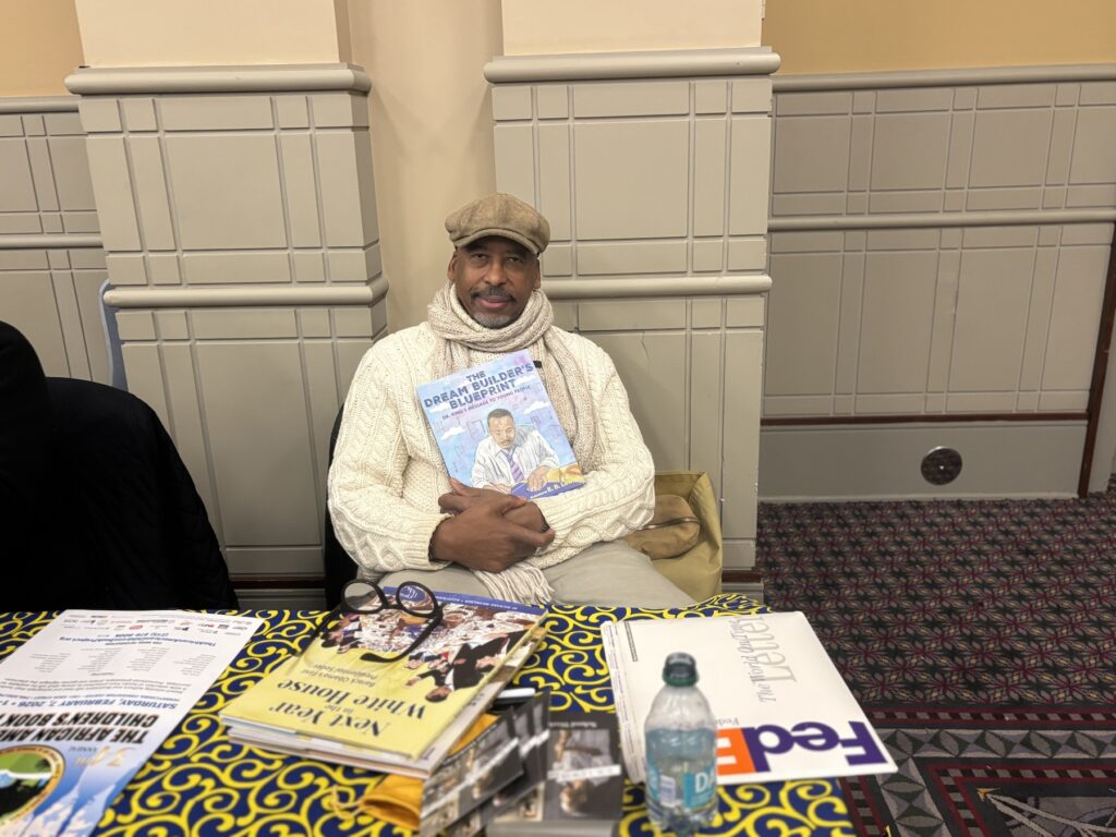 african-american-childrens-book-fair-es-020926-12 Illustrator E.B. Lewis poses with his newest book
