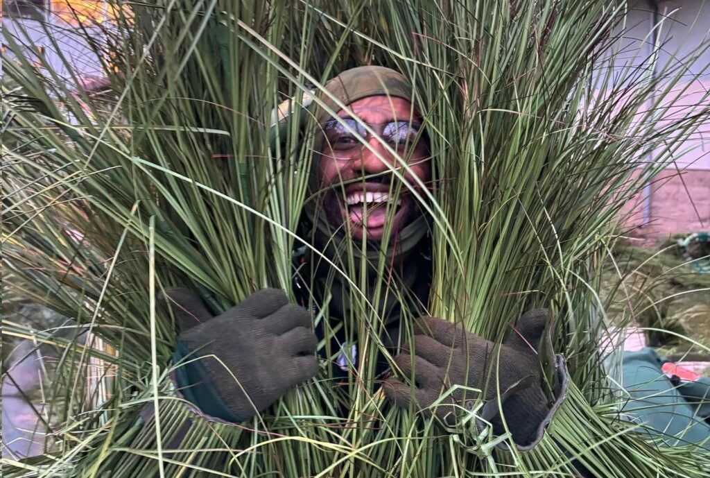 bad-bunny-sugar-cane-dancer-super-bowl-2026 Andrew Athias dressed in costume for Bad Bunny's Super Bowl LX performance