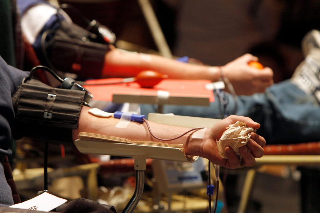 Two people donate blood
