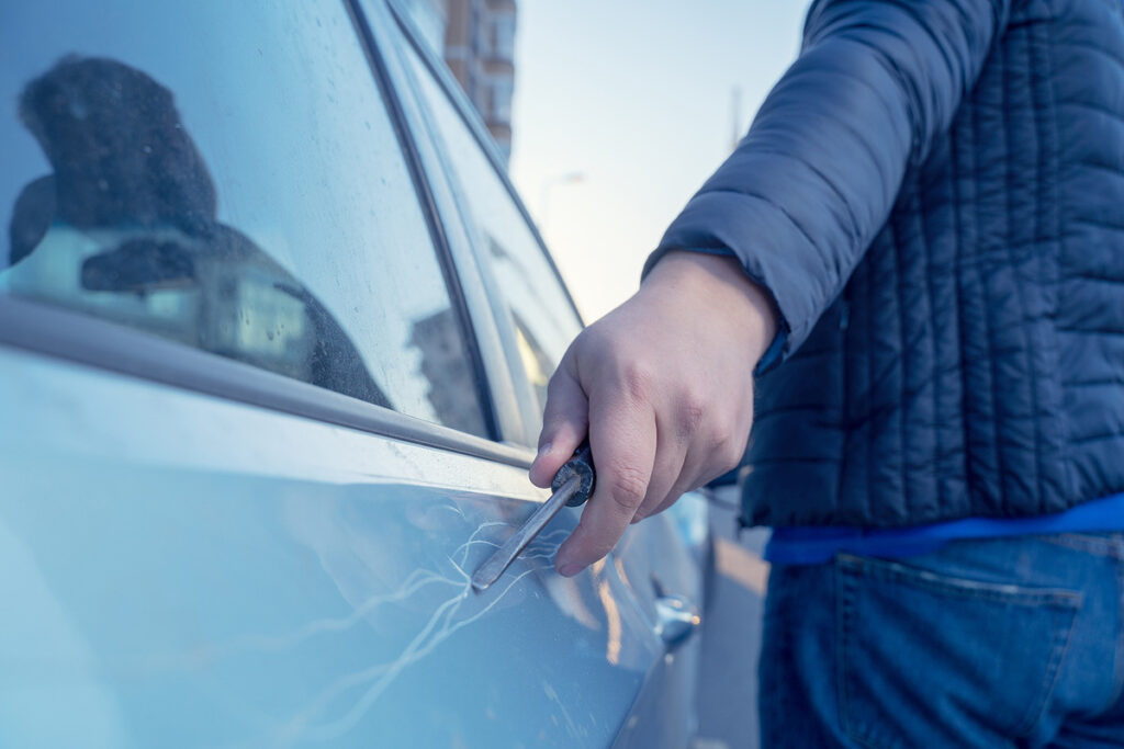 A person is keying a vehicle for revenge. (Masarik/Big Stock)