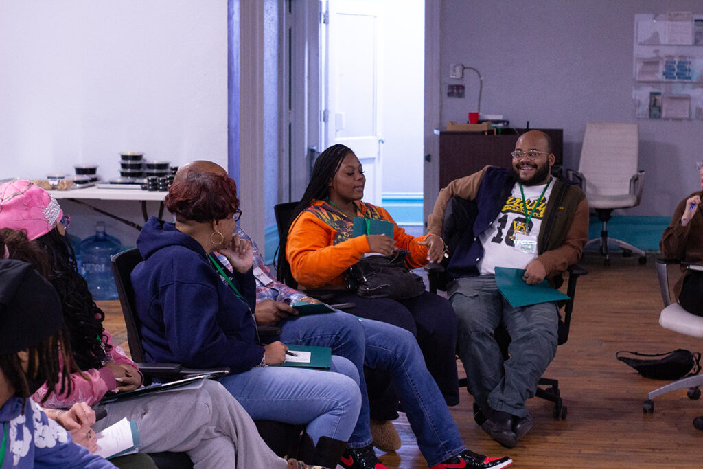 Attendees of the workshop sitting and talking