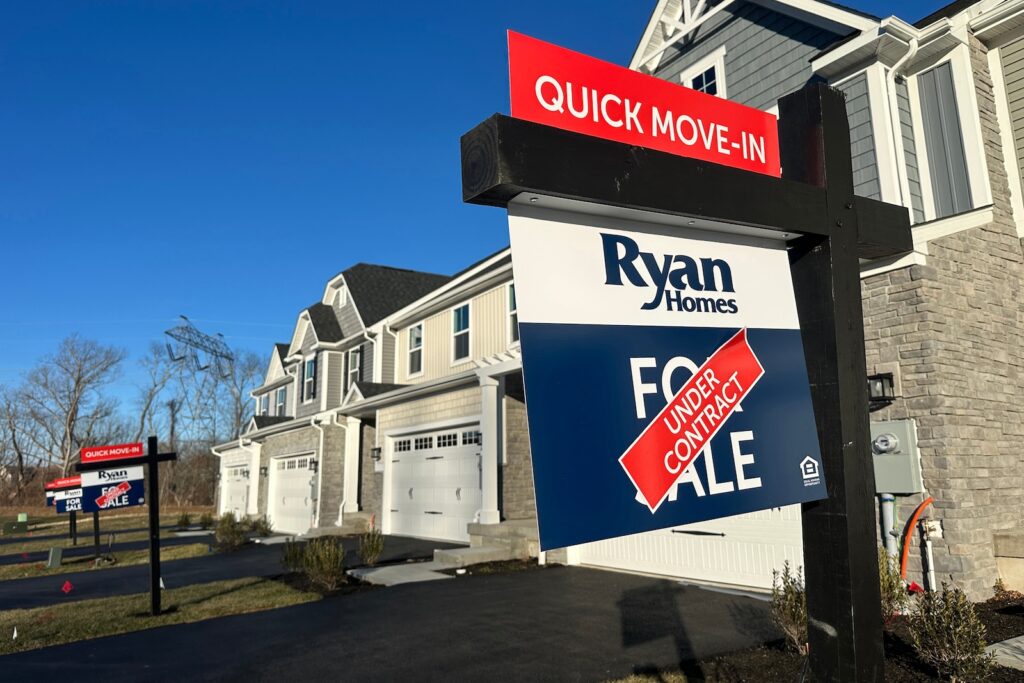 New Housing An ''under contract'' sign is seen atop a ''for sale'' sign outside a home in a residential development in Mount Olive, New Jersey