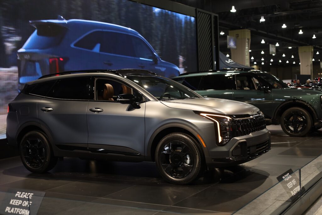 Vehicles on display at the Kia exhibit of the Philly Auto Show