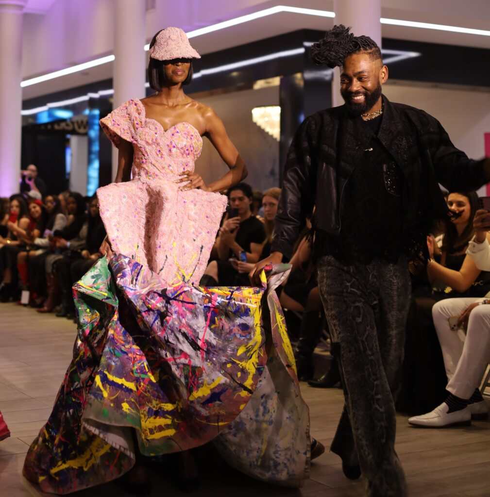 Prajjé Oscar walks with a model