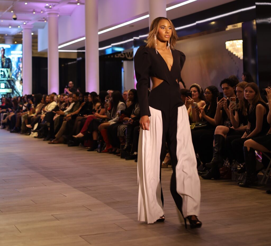 a model wears an outfit by Keiko Myrtice