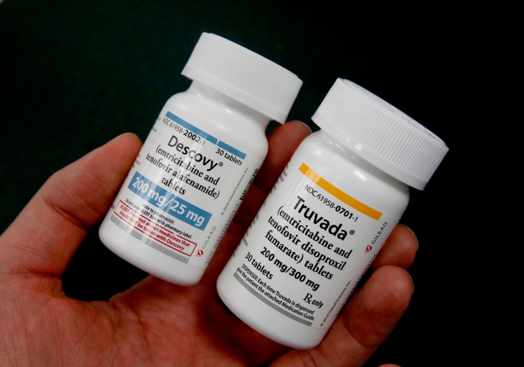 two bottles, of Truvada and Descovy