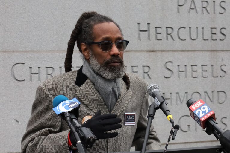 Michael Coard speaking at a press conference at the President's House Site