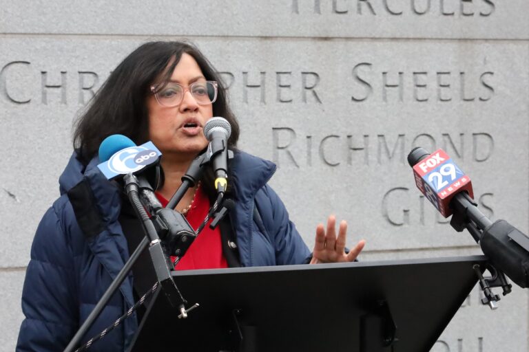 Nina Ahmad speaking at a press conference at the President's House Site