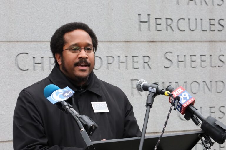 Mijuel Johnson speaking at a press conference at the President's House Site