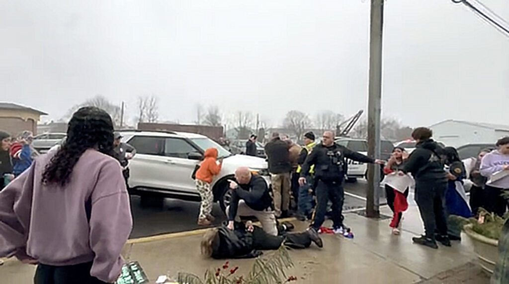 quakertown-pennsylvania-ice-protest-police-response Quakertown police officers are seen Friday morning in this image taken from video arresting someone outside Sunday’s Deli & Restaurant, where students had gathered to protest against U.S. Immigration and Customs Enforcement.