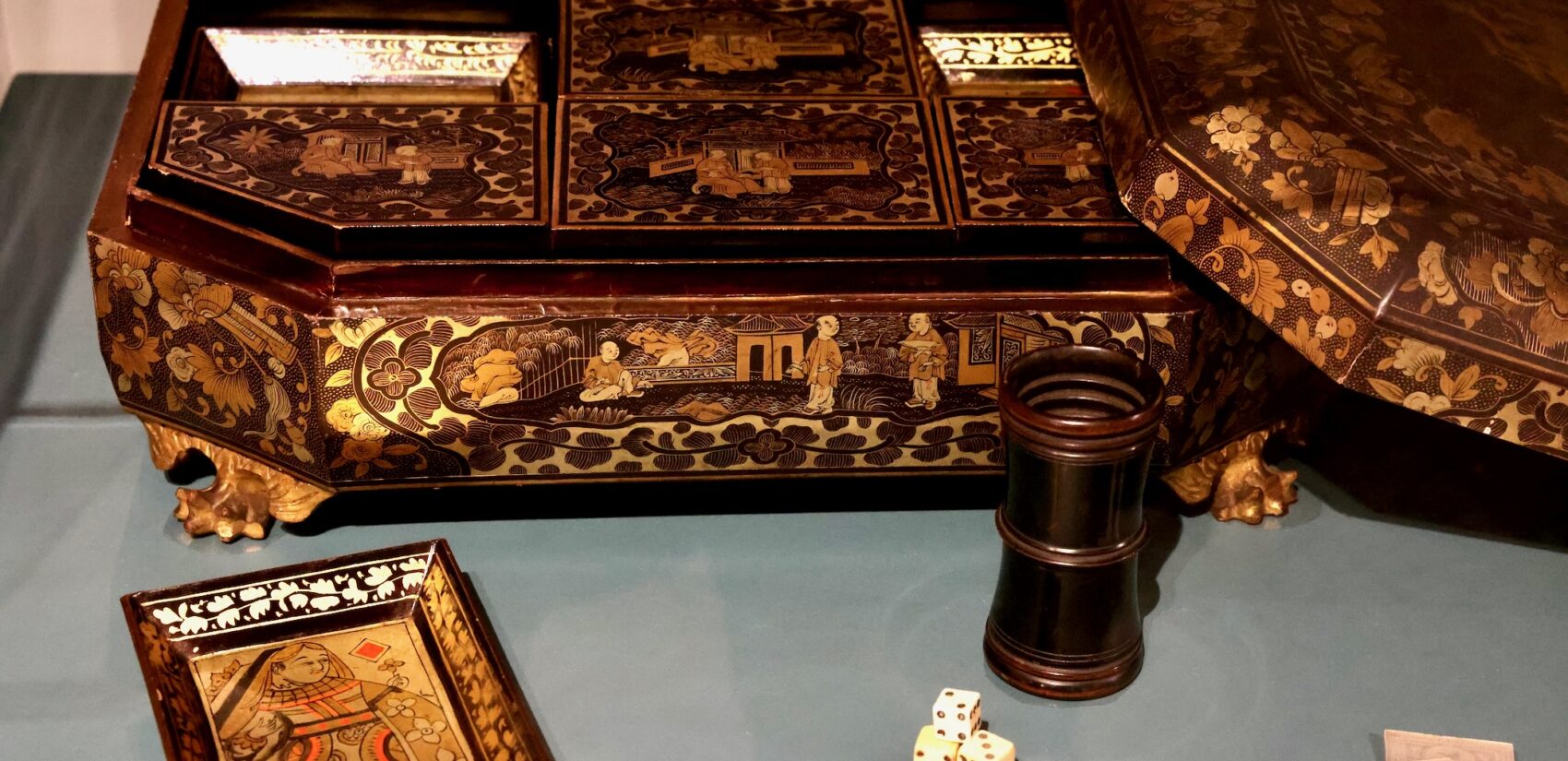 An intricately designed box with game pieces on display.