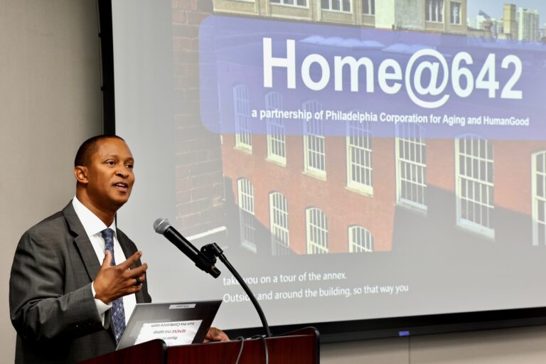Najji Orr is speaking at podium while giving a presentation.