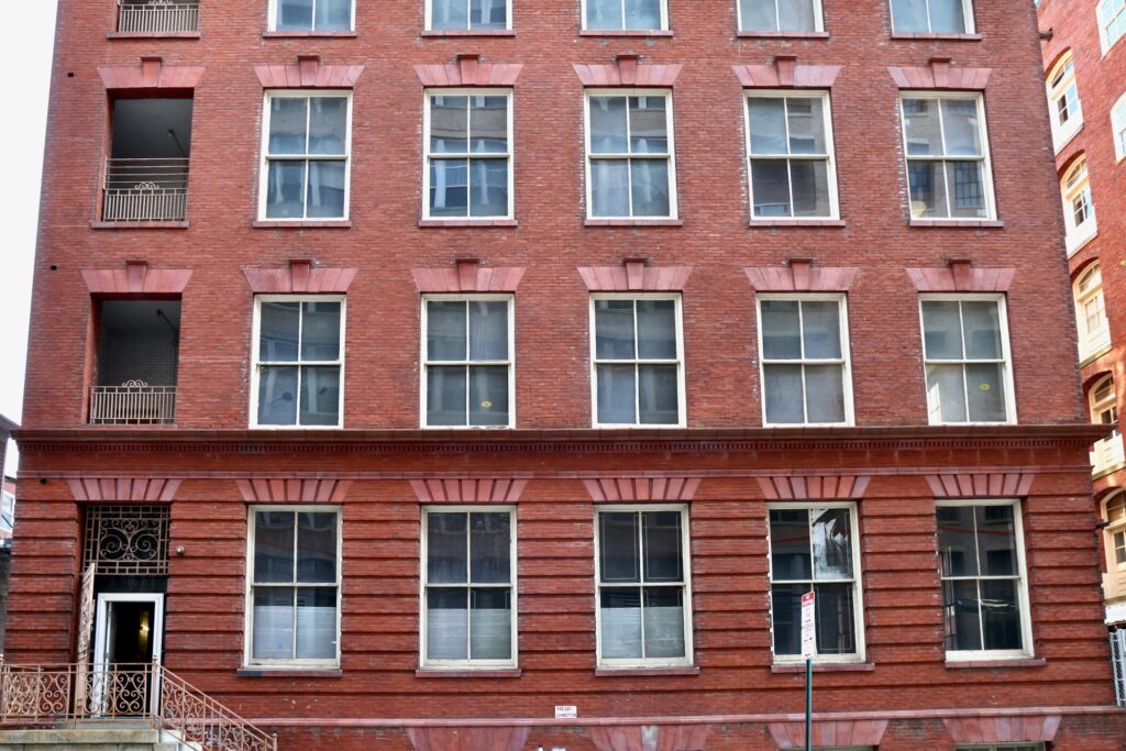 2026 03 26-e lee-philadelphia north broad street corporation for aging-proposed senior housing annex entrance on wallace street The exterior of a large brick building is shown.
