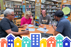 Residents are seen engaging in conversation at a Bridging Blocks event.