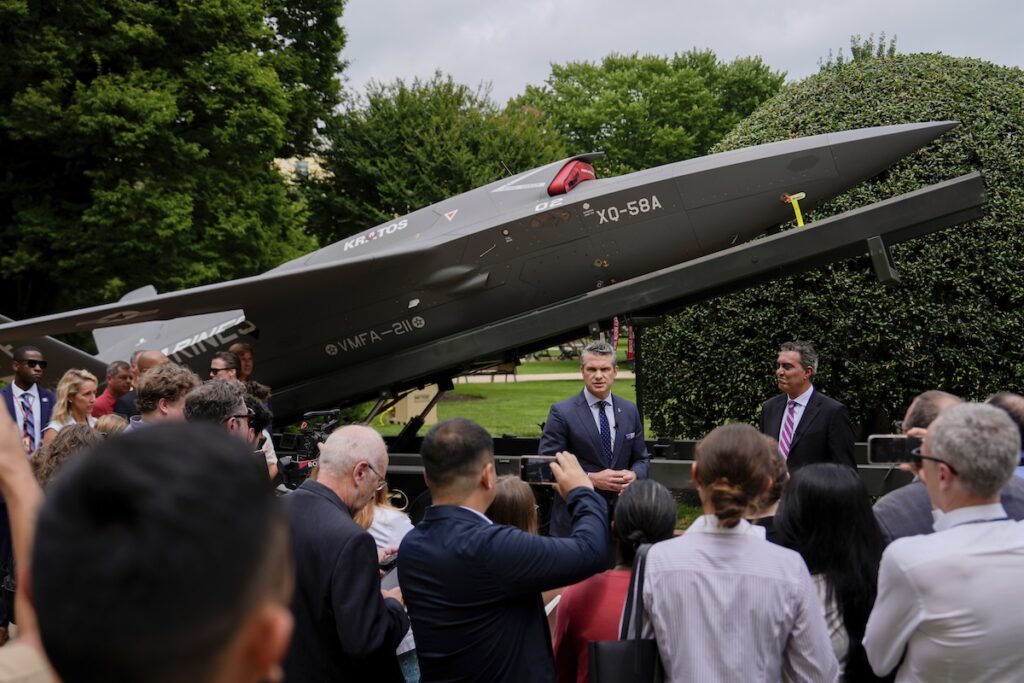 Pentagon Drones Secretary of Defense Pete Hegseth and Under Secretary of Defense for Research and Engineering Emil Michael speak to reporters before looking at a display of multi-domain autonomous systems in the Pentagon courtyard, Wednesday, July 16, 2025, in Washington. (AP Photo/Julia Demaree Nikhinson)
