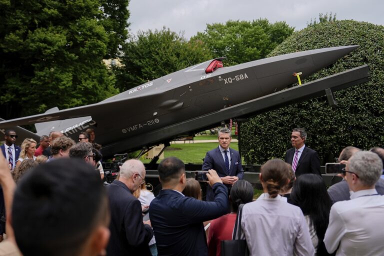 Secretary of Defense Pete Hegseth and Under Secretary of Defense for Research and Engineering Emil Michael speak to reporters before looking at a display of multi-domain autonomous systems in the Pentagon courtyard, Wednesday, July 16, 2025, in Washington. (AP Photo/Julia Demaree Nikhinson)