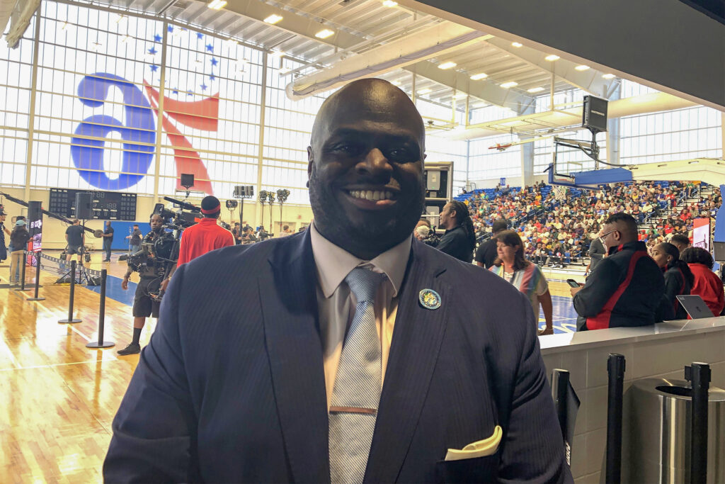 Tony-Allen-2026-03-17 Tony Allen posing for a photo wearing a suit and tie.
