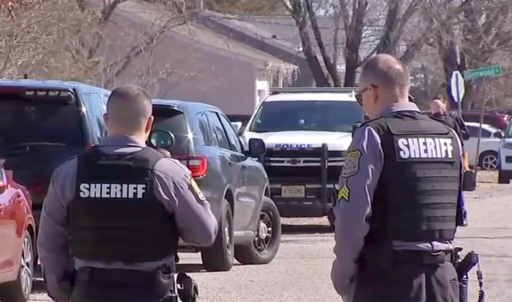 berkeley-township-murder-6abc-2026-03-11 Two officers wearing Sheriff vests stand with their backs to the camera
