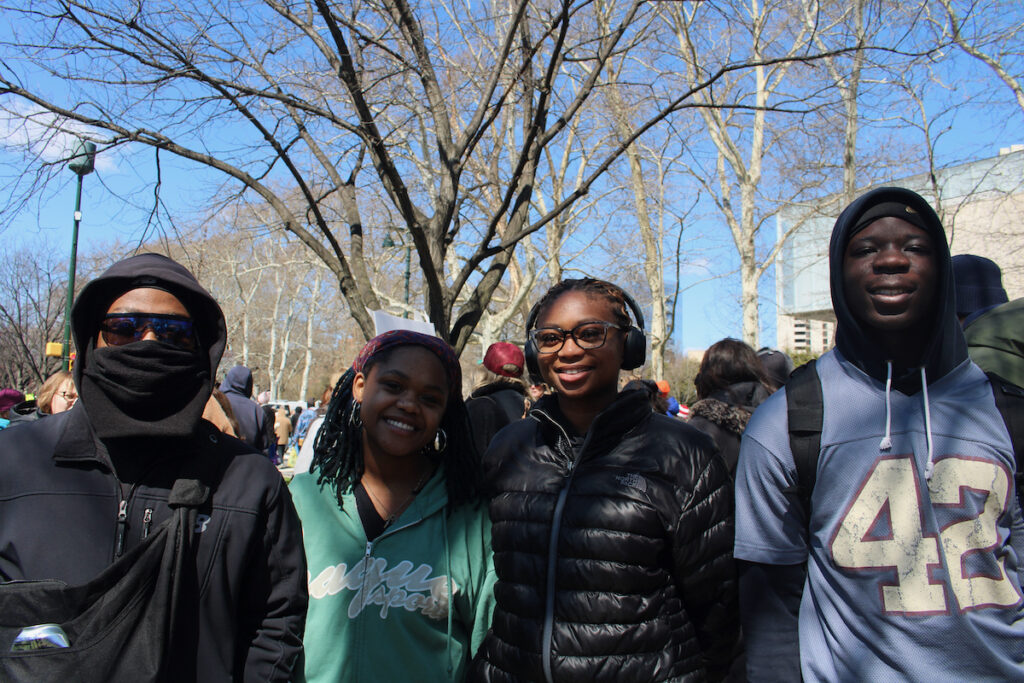 Four college students pose for a photo as they