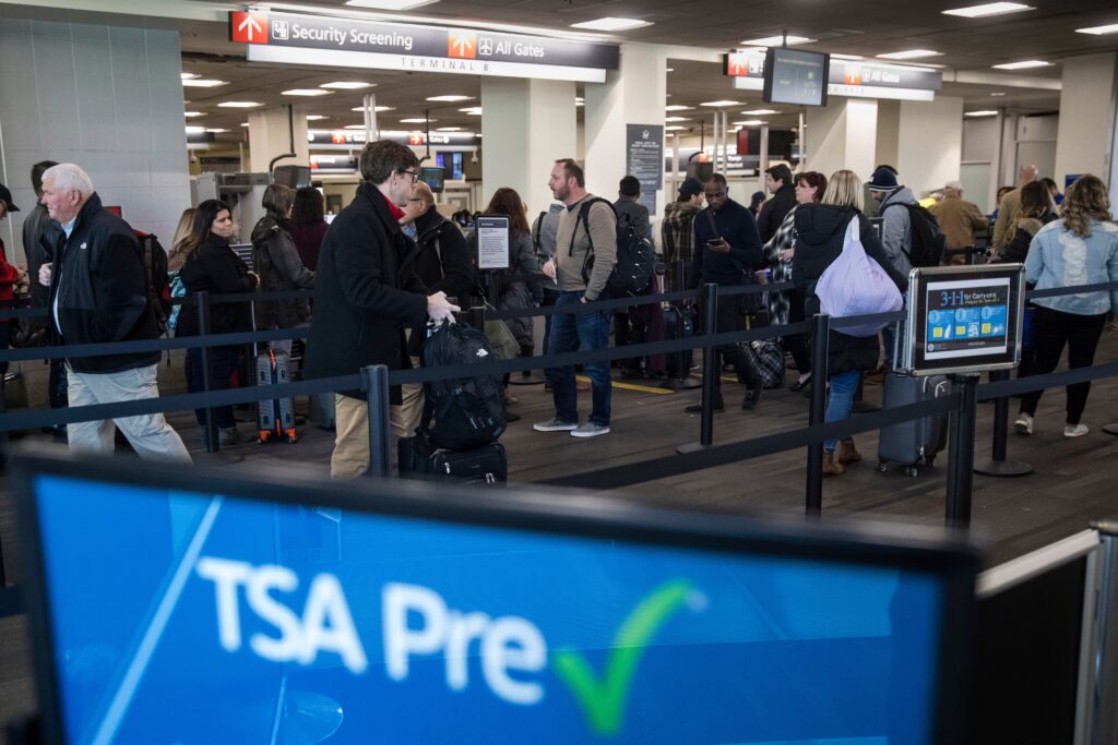 phl-airport-tsa-2019-01-11-ap passengers wait in line at a Transportation Security Administration checkpoint at the Philadelphia International Airport