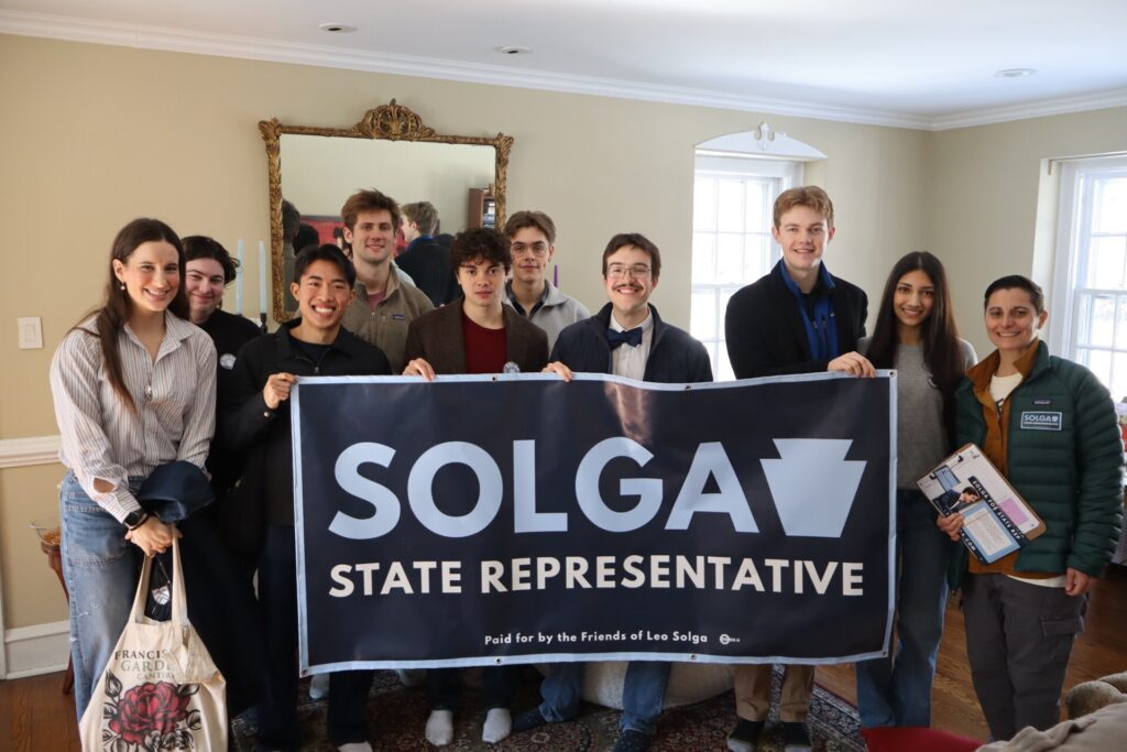 solga campaing Leo Solga and supporters holding up a large campaign poster