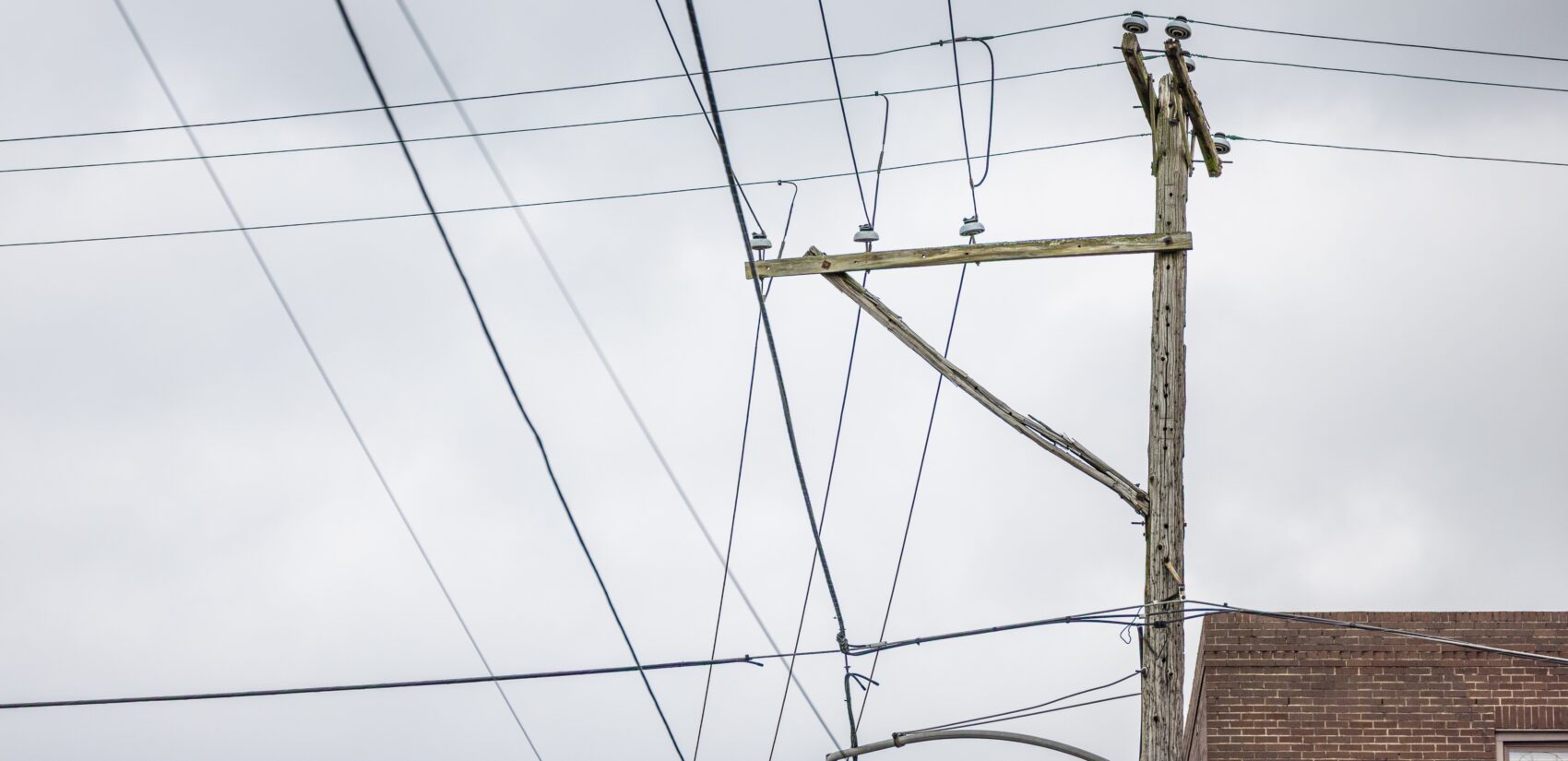 a damaged cross arm on an electrical utility pole