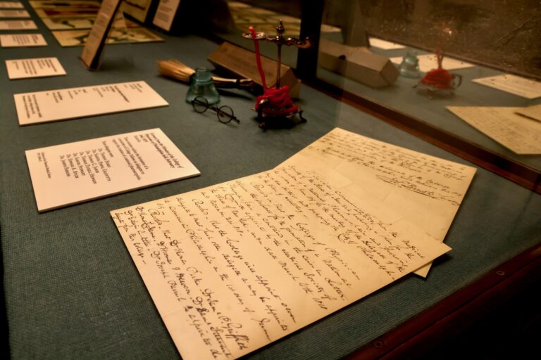 Handwritten notes shown in a display case