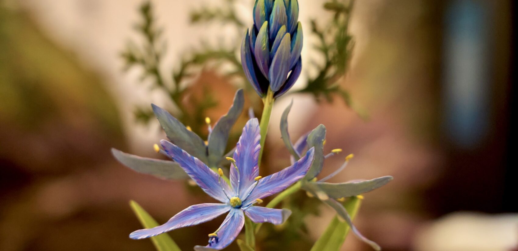 A close up view of a 3-D printd flowering plant.
