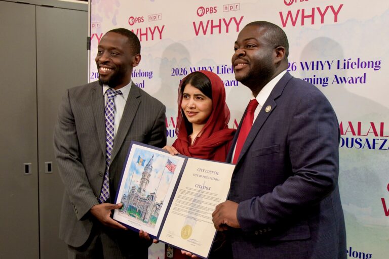 Malala Yousafzai receives a citation from Philadelphia City Councilmembers Isaiah Thomas and Anthony Phillips
