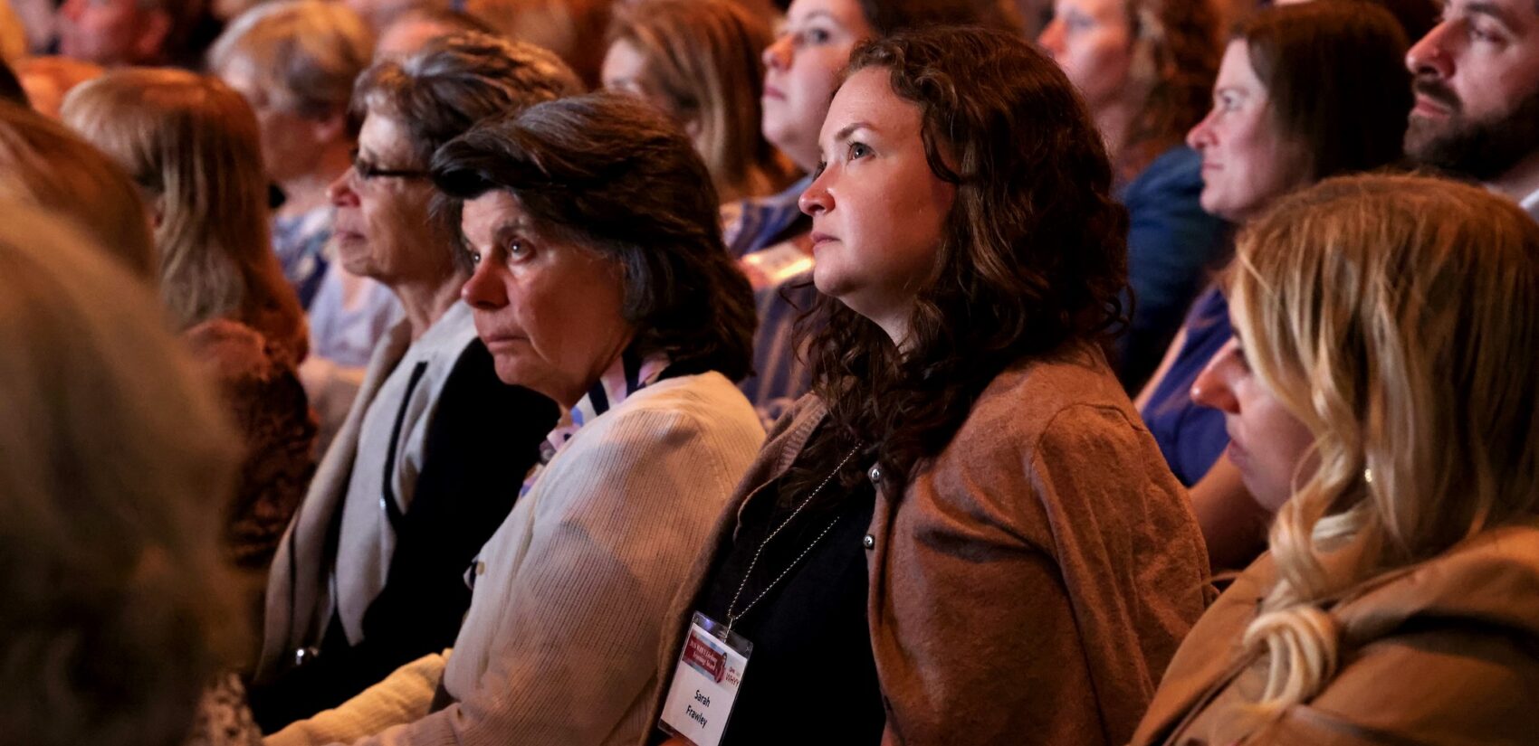 Audience members at WHYY's Lifelong Learning Award presentation listen as Terry Gross interviews the 2026 recipient, Malala Yousafzai
