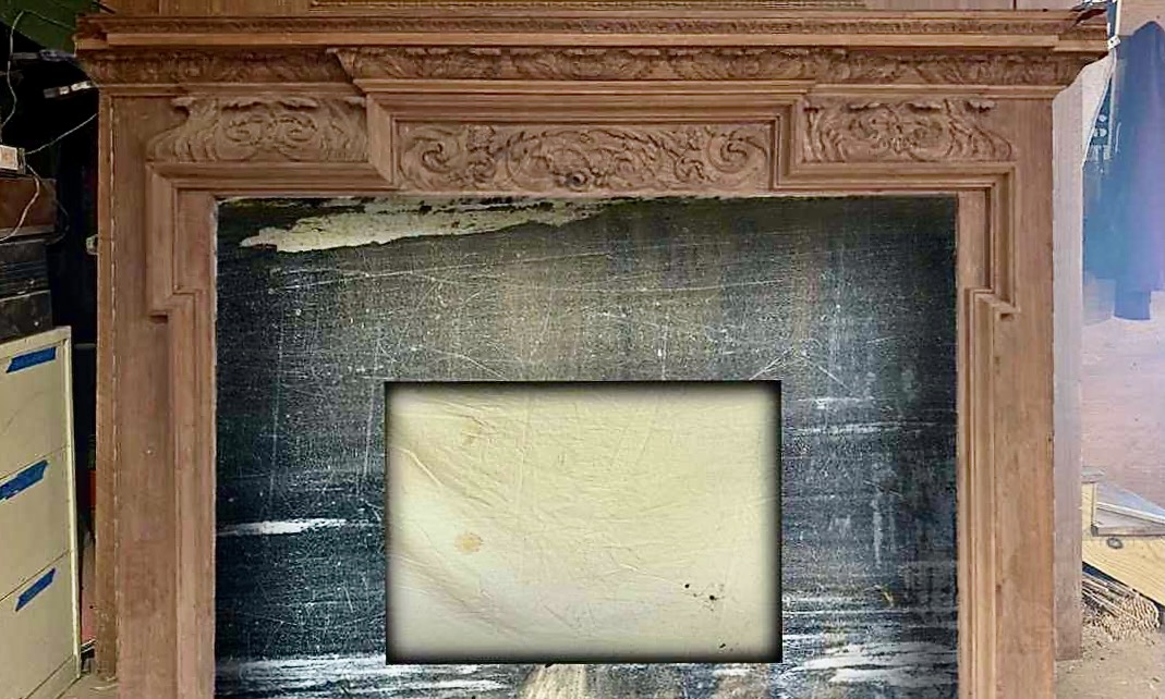 Historic marble reclaimed from the Please Touch Museum is being repurposed in a fireplace