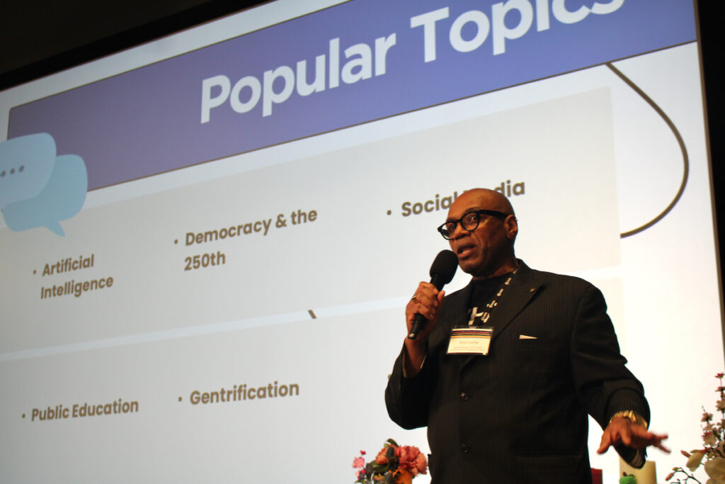 2026-whyy-civic-news-summit-1 Tony Cuffie, senior manager, WHYY News Community and Engagement Team, speaks into a microphone at the WHYY Civic News Summit