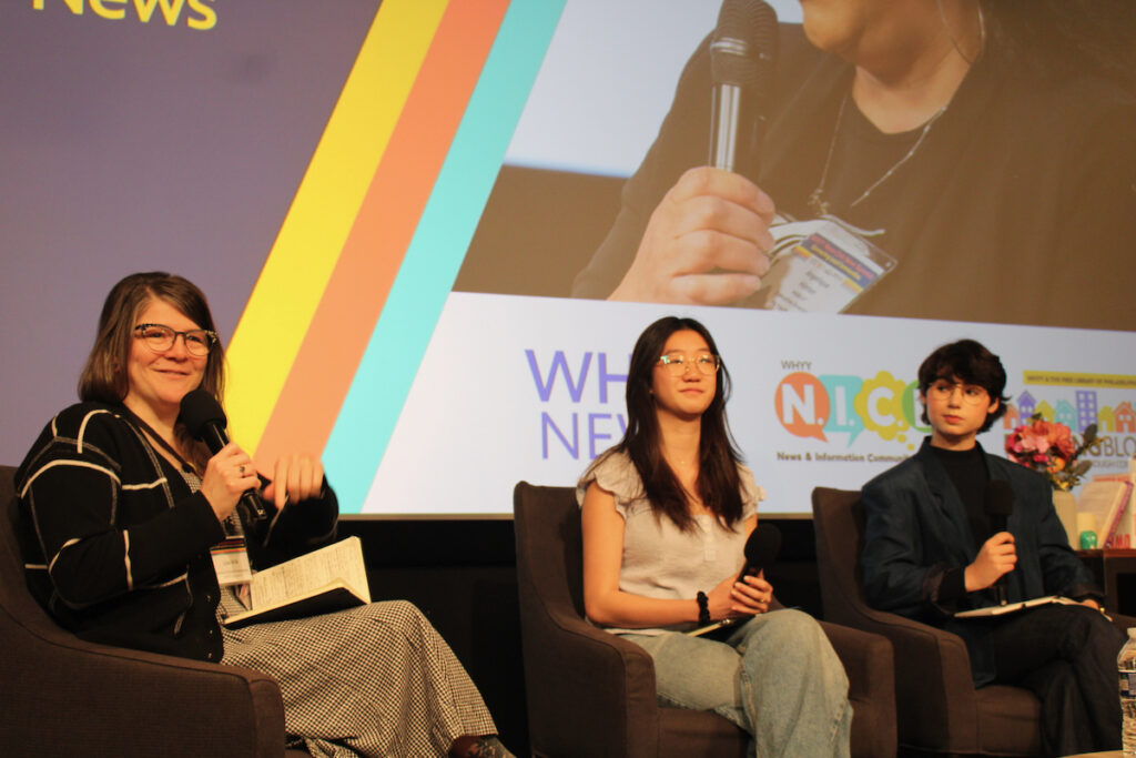 From left to right, Lisa Wilk, director of school partnerships, WHYY education, speaks with student journalists Kaitlyn Ho and Amelia Candeub at the WHYY Civic News Summit